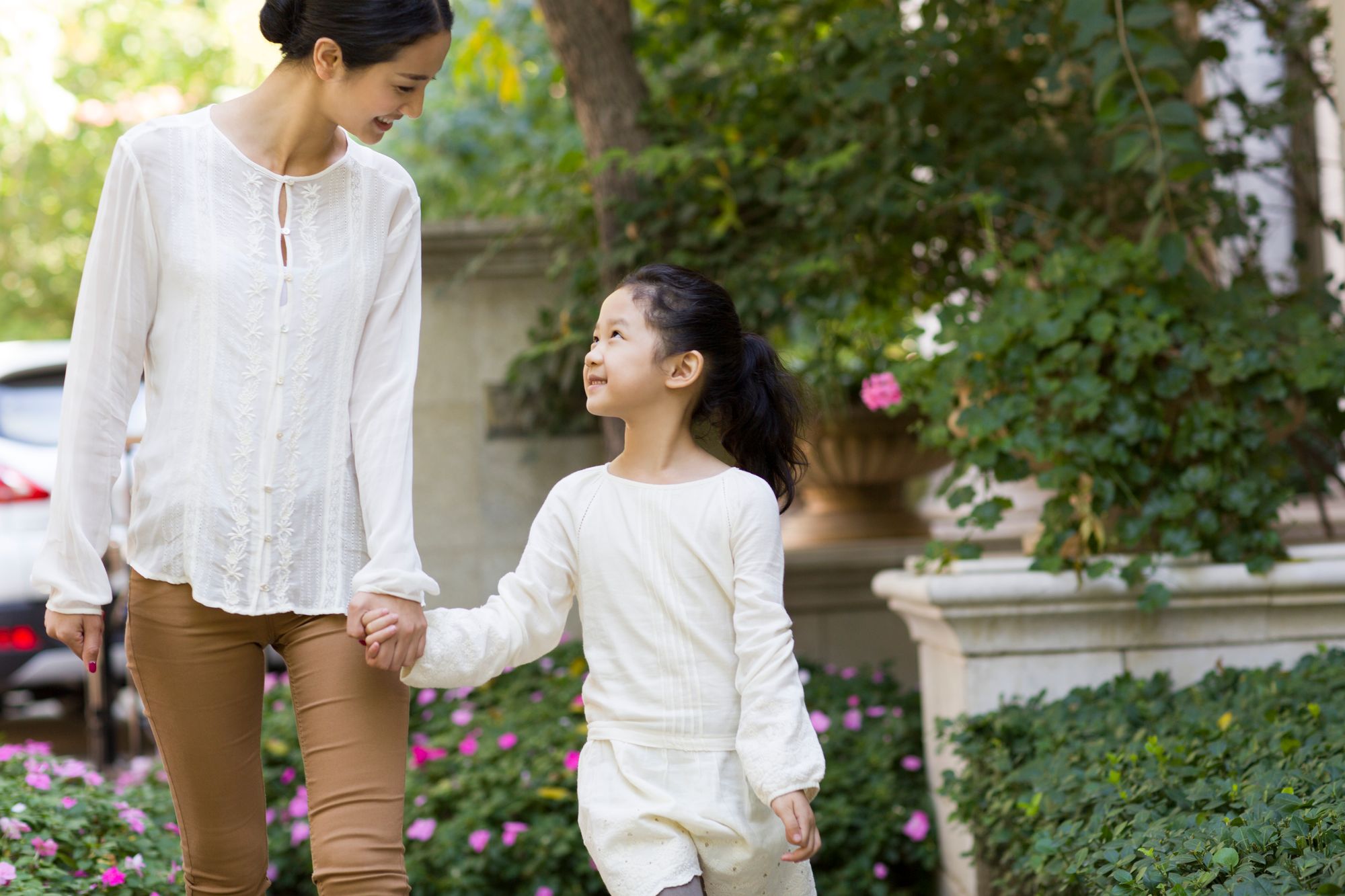 mother-and-daughter-holding-hands-walking-together-2022-04-01-20-36-28-utc